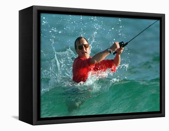 Waves Splash President-Elect George Bush as He Casts a Line While Surf-Fishing-null-Framed Stretched Canvas