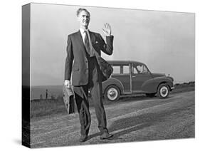 Waving Sales Rep with a Moris Minor Shooting Brake, 3rd Aug 1963-Michael Walters-Stretched Canvas