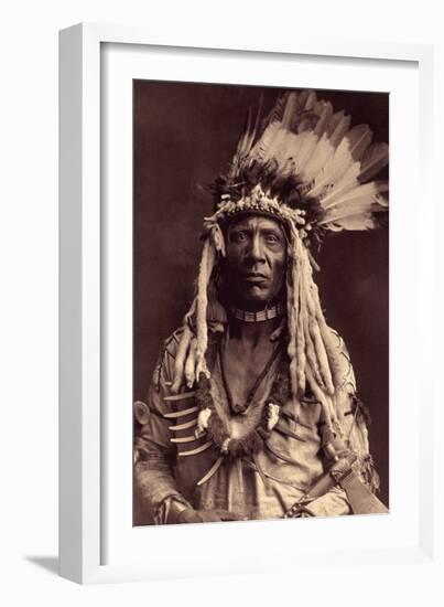 Weasel Tail (Apohsuyis). this Indian Piegan Wears the Famous War Hedge in Eagle Feathers and Weasel-Edward Sheriff Curtis-Framed Giclee Print