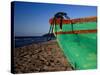 Weathered Wooden Boat Prow on Beach, Tela, Atlantida, Honduras-Jeffrey Becom-Stretched Canvas