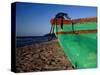 Weathered Wooden Boat Prow on Beach, Tela, Atlantida, Honduras-Jeffrey Becom-Stretched Canvas