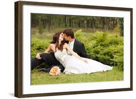 Wedding, Beautiful Young Bride Lying Together with Groom in Love on Green Grass Kissing-khorzhevska-Framed Photographic Print