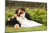 Wedding, Beautiful Young Bride Lying Together with Groom in Love on Green Grass Kissing-khorzhevska-Mounted Photographic Print