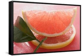 Wedge of Pink Grapefruit on Slice of Grapefruit with Leaf-Foodcollection-Framed Stretched Canvas