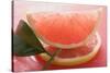 Wedge of Pink Grapefruit on Slice of Grapefruit with Leaf-Foodcollection-Stretched Canvas