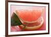 Wedge of Pink Grapefruit on Slice of Grapefruit with Leaf-Foodcollection-Framed Photographic Print