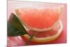 Wedge of Pink Grapefruit on Slice of Grapefruit with Leaf-Foodcollection-Mounted Photographic Print