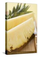 Wedges of Pineapple on Chopping Board-Foodcollection-Stretched Canvas