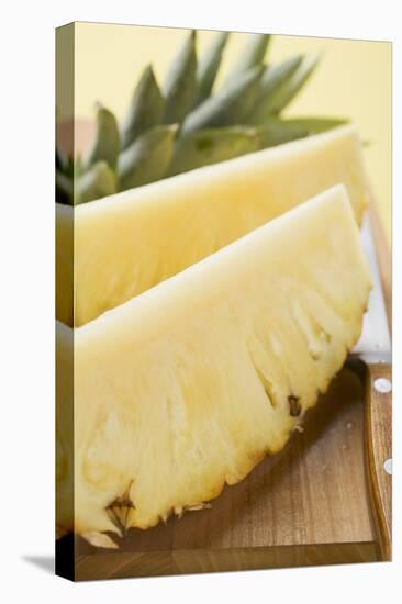 Wedges of Pineapple on Chopping Board-Foodcollection-Stretched Canvas