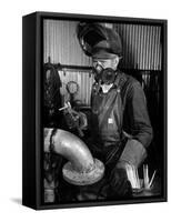 Welder Working in the Shipbuilding Industry-George Strock-Framed Stretched Canvas