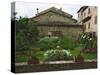 Well and Garden Courtyard, Buonconvento, Italy-Dennis Flaherty-Stretched Canvas