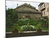 Well and Garden Courtyard, Buonconvento, Italy-Dennis Flaherty-Mounted Photographic Print