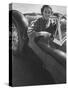 Well Dressed Woman Behind the Wheel of a Foreign Made Roadster-Nina Leen-Stretched Canvas