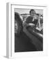 Well Dressed Woman Behind the Wheel of a Foreign Made Roadster-Nina Leen-Framed Photographic Print