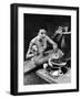 Well-Dressed Woman Cooking a Large Steak on the Aluminum Disposable Barbecue Grill-Peter Stackpole-Framed Premium Photographic Print