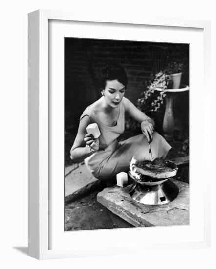 Well-Dressed Woman Cooking a Large Steak on the Aluminum Disposable Barbecue Grill-Peter Stackpole-Framed Photographic Print
