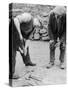 Welsh Blacksmith at Work Filing a Horse's Hoof on a Farm in Carnarvonshire-null-Stretched Canvas