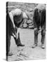 Welsh Blacksmith at Work Filing a Horse's Hoof on a Farm in Carnarvonshire-null-Stretched Canvas
