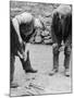 Welsh Blacksmith at Work Filing a Horse's Hoof on a Farm in Carnarvonshire-null-Mounted Photographic Print