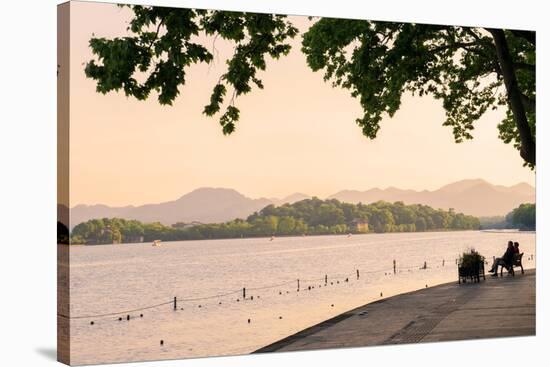 West Lake Shore with Hilly Landscape and Silhouettes, Hangzhou, Zhejiang, China, Asia-Andreas Brandl-Stretched Canvas