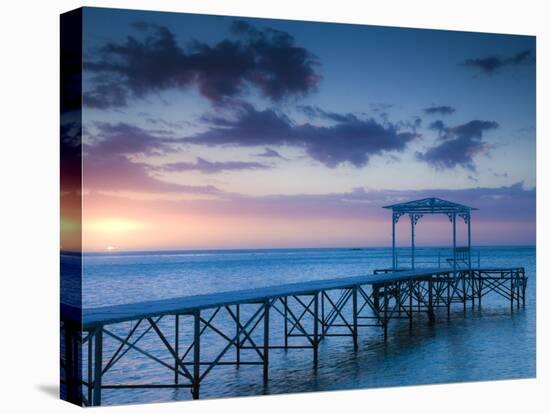 Western Mauritius, Le Morne Peninsula, Pier at the Dinarobin Hotel, Dusk, Mauritius-Walter Bibikow-Stretched Canvas