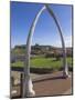 Whalebone Arch on Seafront, with Whitby Abbey Ruin in Distance, Whitby, Yorkshire-Neale Clarke-Mounted Photographic Print