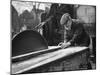 Wheelwright Working with a Circular Saw, February 1935-null-Mounted Photographic Print