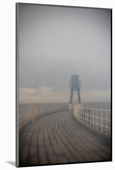 Whitby Harbour West Lighthouse in Mist  2020  (photograph)-Ant Smith-Mounted Photographic Print