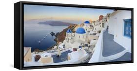 White Houses and Blue Domes of the Churches Dominate the Aegean Sea, Oia, Santorini-Roberto Moiola-Framed Stretched Canvas