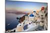 White Houses and Blue Domes of the Churches Dominate the Aegean Sea, Oia, Santorini-Roberto Moiola-Mounted Photographic Print