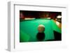 White pool ball lit by electric lights in a restaurant and bar in Shoshone, CA near Death Valley...-null-Framed Photographic Print