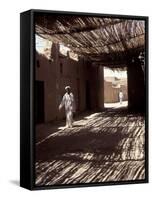 White-robed Man Walks under Thatched Canopy, Morocco-Merrill Images-Framed Stretched Canvas
