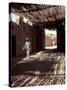 White-robed Man Walks under Thatched Canopy, Morocco-Merrill Images-Stretched Canvas