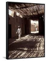 White-robed Man Walks under Thatched Canopy, Morocco-Merrill Images-Framed Photographic Print