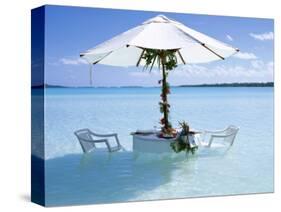 White Table, Chairs and Parasol in the Ocean, Bora Bora (Borabora), Society Islands-Mark Mawson-Stretched Canvas