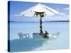 White Table, Chairs and Parasol in the Ocean, Bora Bora (Borabora), Society Islands-Mark Mawson-Stretched Canvas