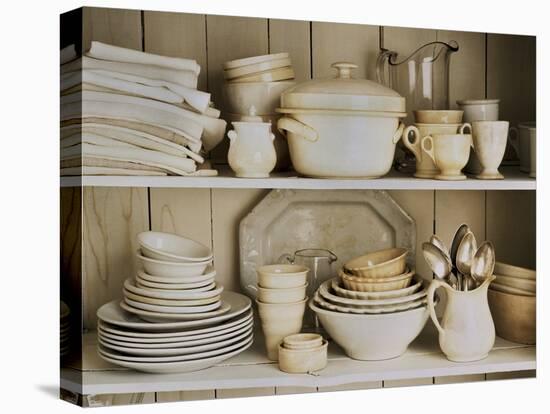 White Tableware and Table Cloths on a Kitchen Shelf-Ellen Silverman-Stretched Canvas