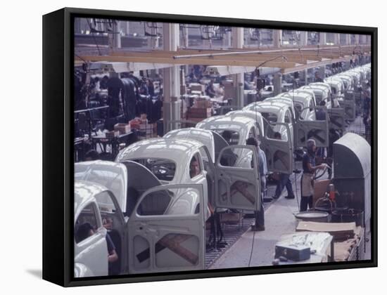 White Volkswagens Coming Down Assembly Line in Brazilian Factory-Paul Schutzer-Framed Stretched Canvas