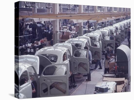 White Volkswagens Coming Down Assembly Line in Brazilian Factory-Paul Schutzer-Stretched Canvas