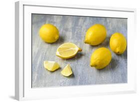 Whole and Sliced Lemons on Grey Subsoil-Jana Ihle-Framed Photographic Print