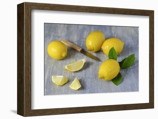 Whole and Sliced Lemons on Grey Subsoil-Jana Ihle-Framed Photographic Print