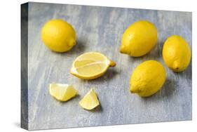 Whole and Sliced Lemons on Grey Subsoil-Jana Ihle-Stretched Canvas