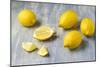 Whole and Sliced Lemons on Grey Subsoil-Jana Ihle-Mounted Photographic Print