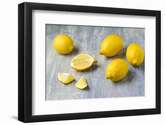 Whole and Sliced Lemons on Grey Subsoil-Jana Ihle-Framed Photographic Print
