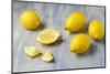 Whole and Sliced Lemons on Grey Subsoil-Jana Ihle-Mounted Photographic Print