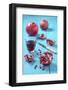 Whole and Sliced Pomegranate and Glass of Pomegranate Juice on Turquoise Wooden Table-Jana Ihle-Framed Photographic Print