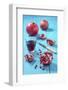 Whole and Sliced Pomegranate and Glass of Pomegranate Juice on Turquoise Wooden Table-Jana Ihle-Framed Photographic Print