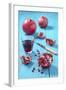 Whole and Sliced Pomegranate and Glass of Pomegranate Juice on Turquoise Wooden Table-Jana Ihle-Framed Photographic Print