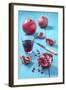 Whole and Sliced Pomegranate and Glass of Pomegranate Juice on Turquoise Wooden Table-Jana Ihle-Framed Photographic Print