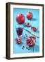 Whole and Sliced Pomegranate and Glass of Pomegranate Juice on Turquoise Wooden Table-Jana Ihle-Framed Photographic Print